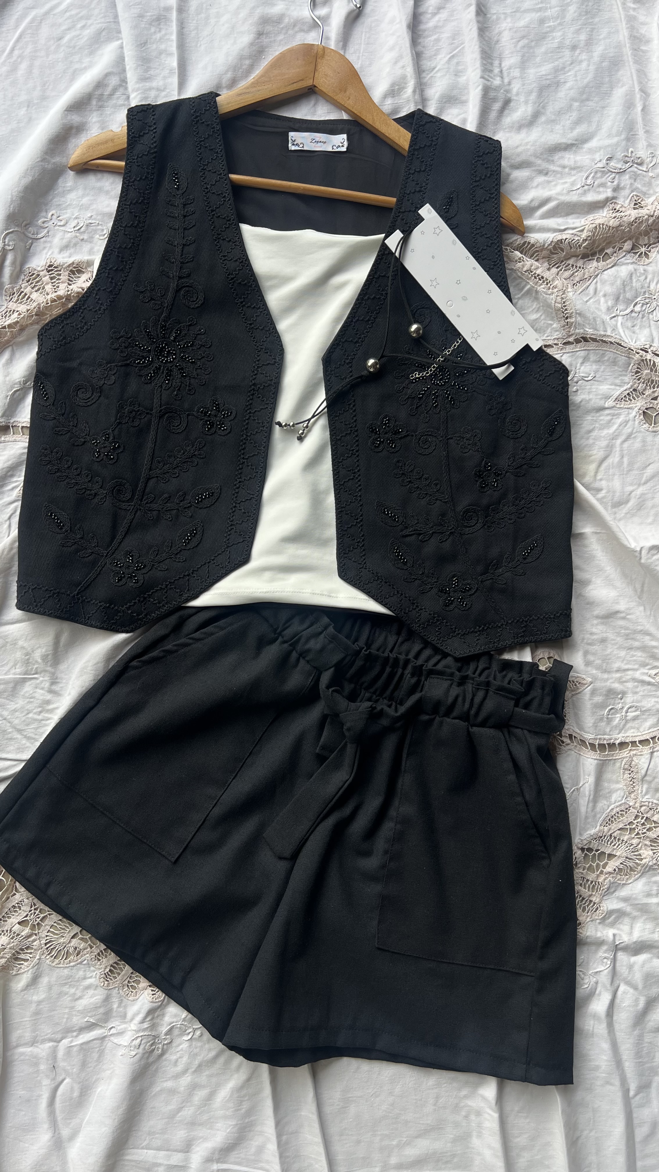 Short lino bolsillos cuadrado y lazo